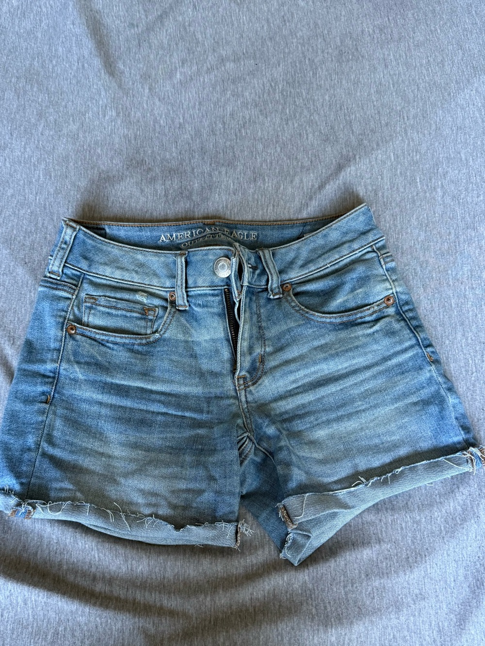 American Eagle Outfitters faded blue denim cutoff shorts